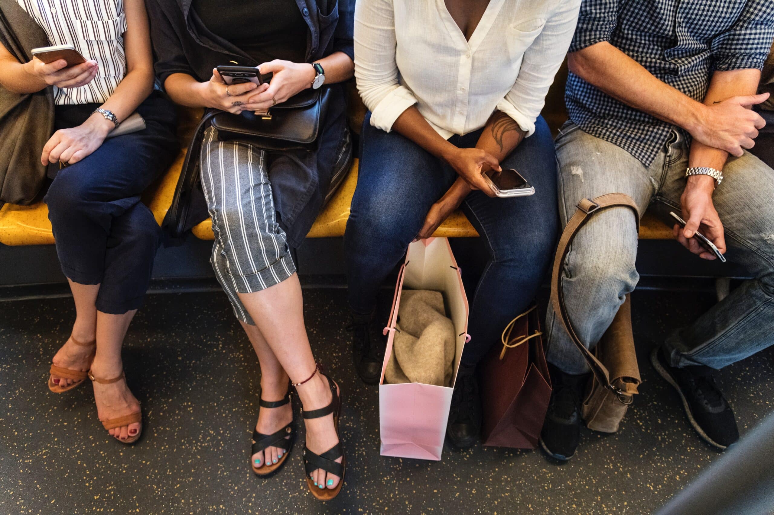 Photo of people sitting on a subway