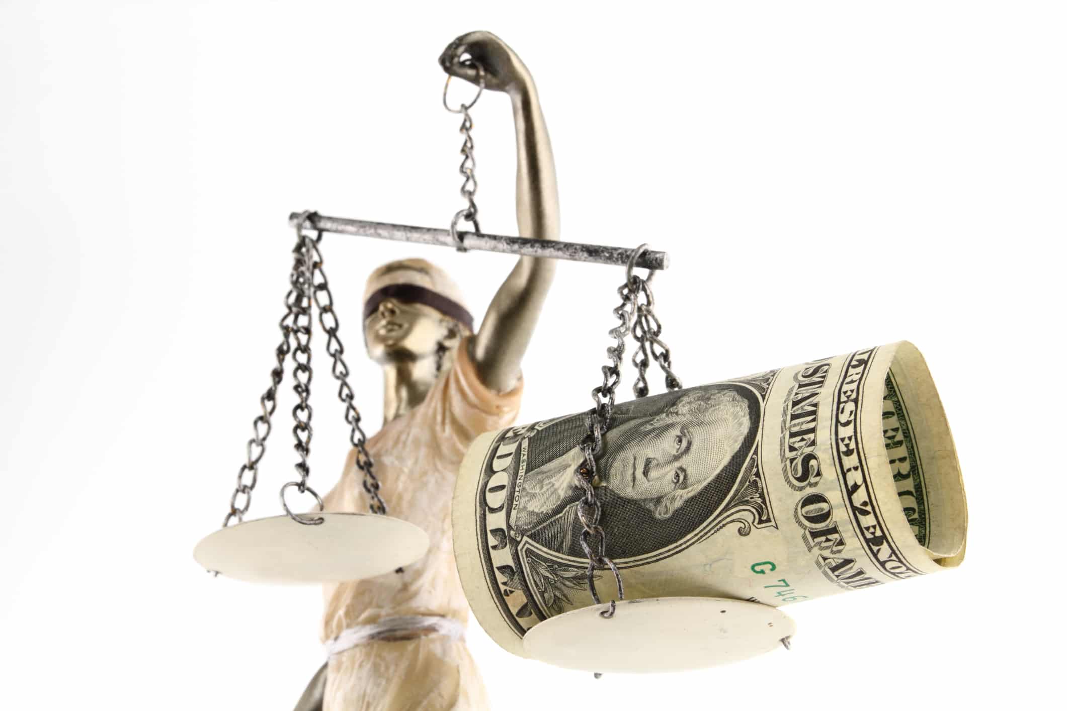 Money myths. lady justice blindfolded with scales, sword and money on one scale.
