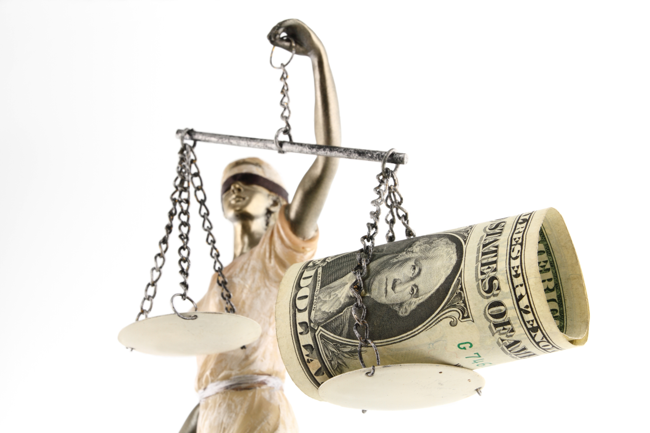 Money myths. lady justice blindfolded with scales, sword and money on one scale.
