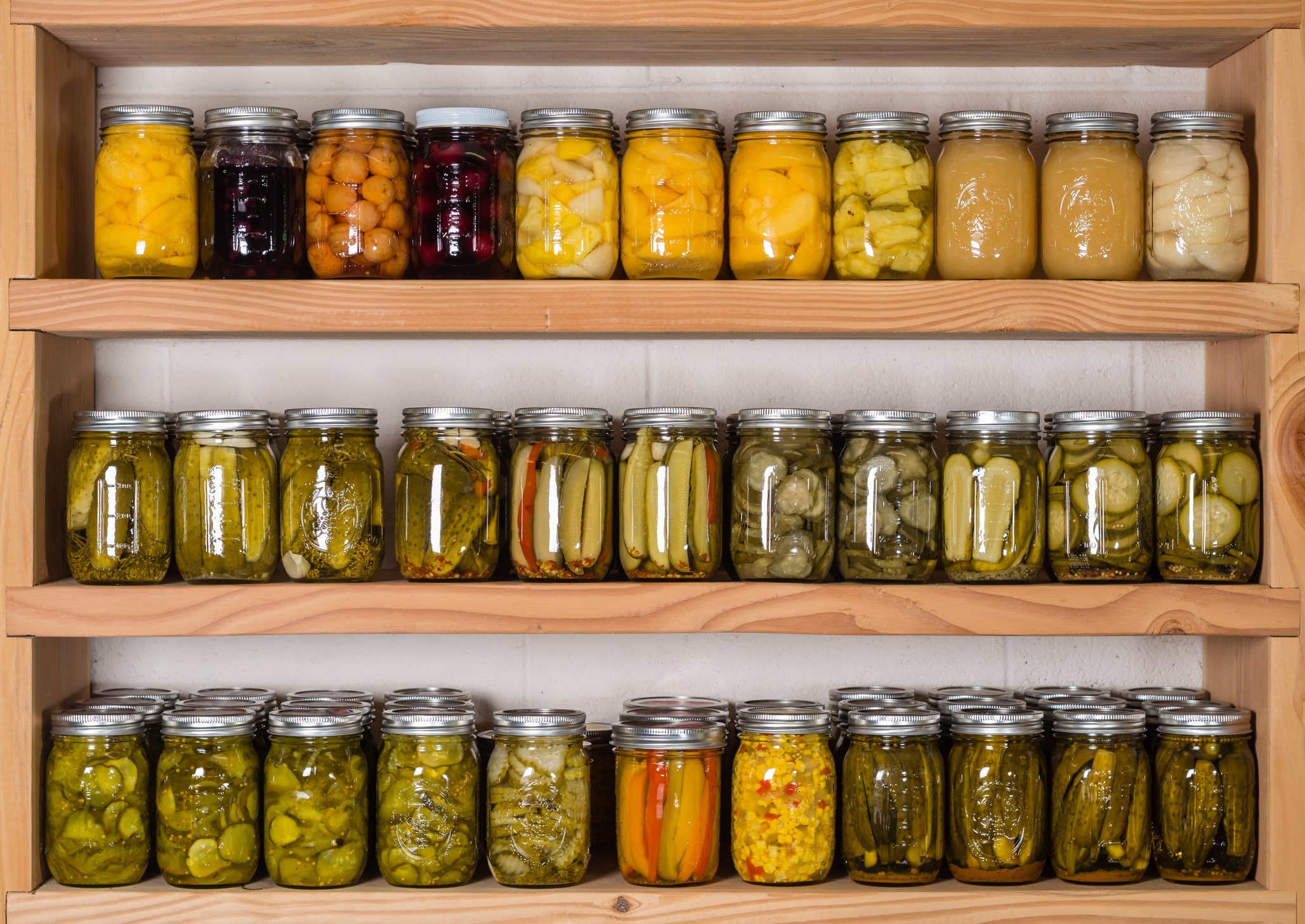 stop food waste. Storage shelves in pantry with homemade canned preserved fruits and vegetables