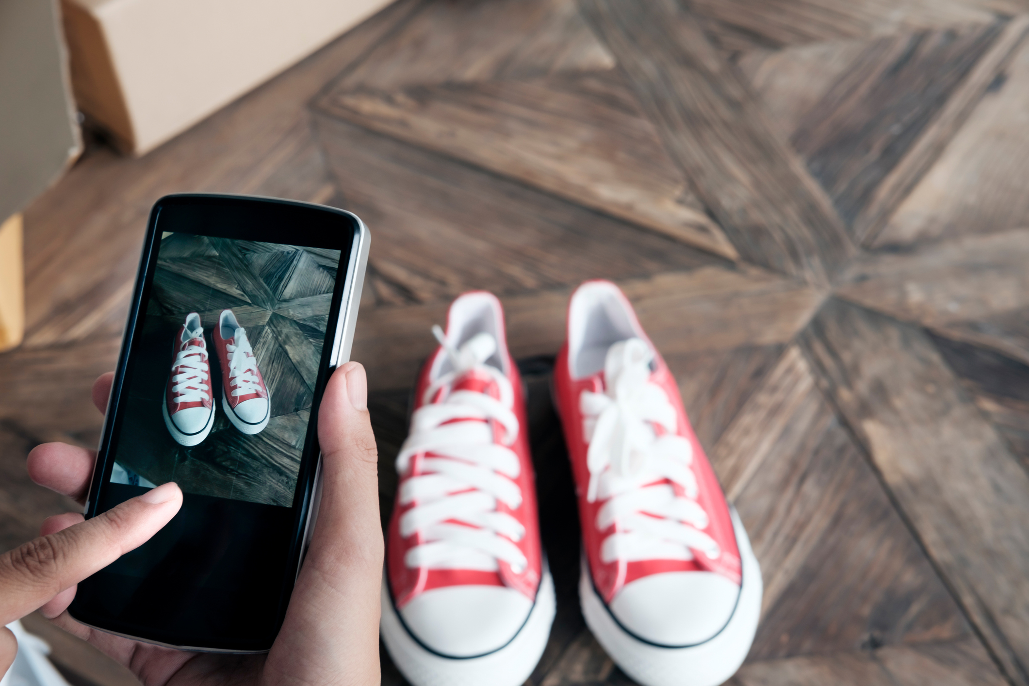 how to use facebook marketplace. Online seller use mobile phone take a photo of product for upload to website online shop.