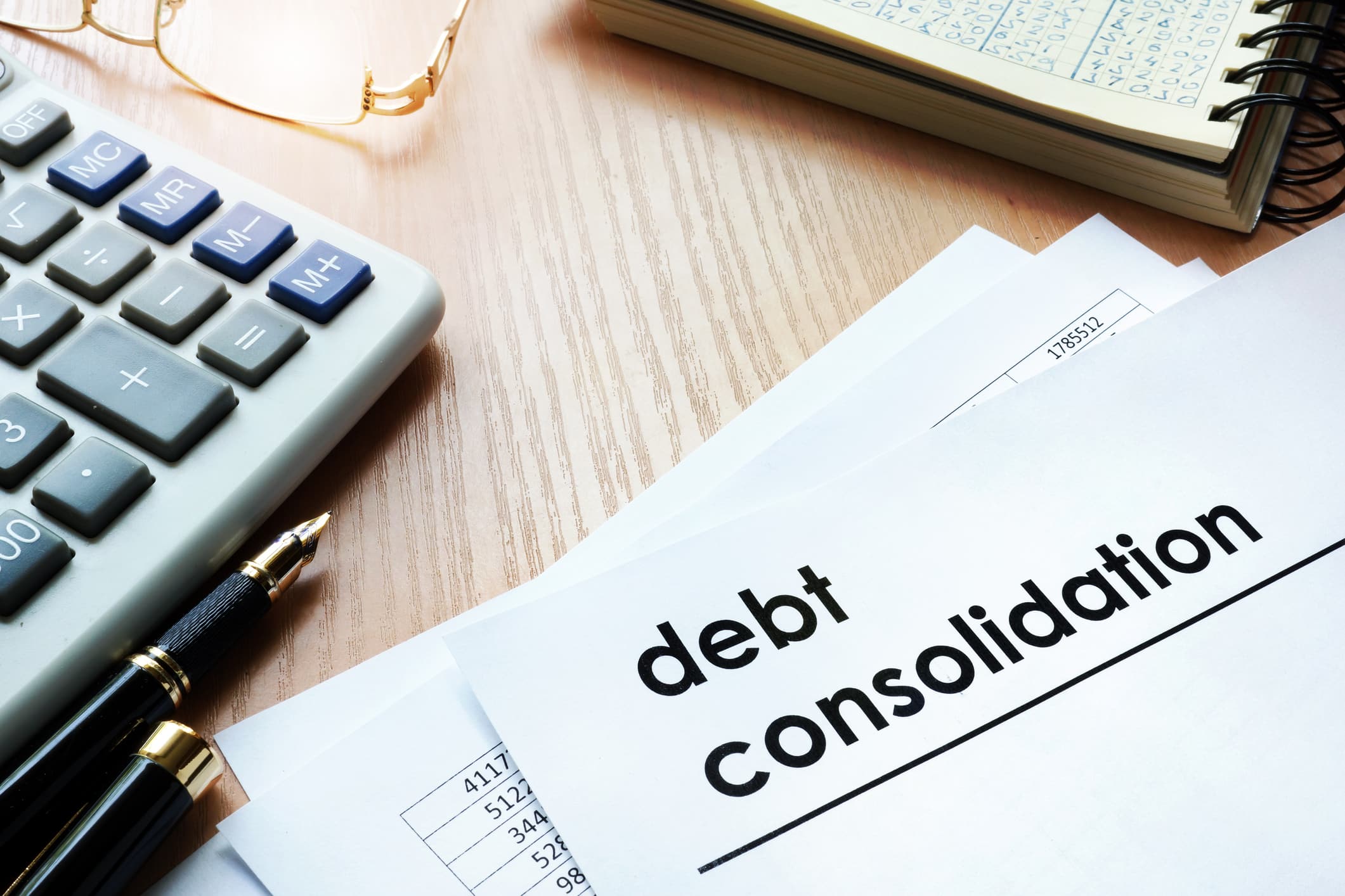 debt consolidation loan. Documents on an office table.