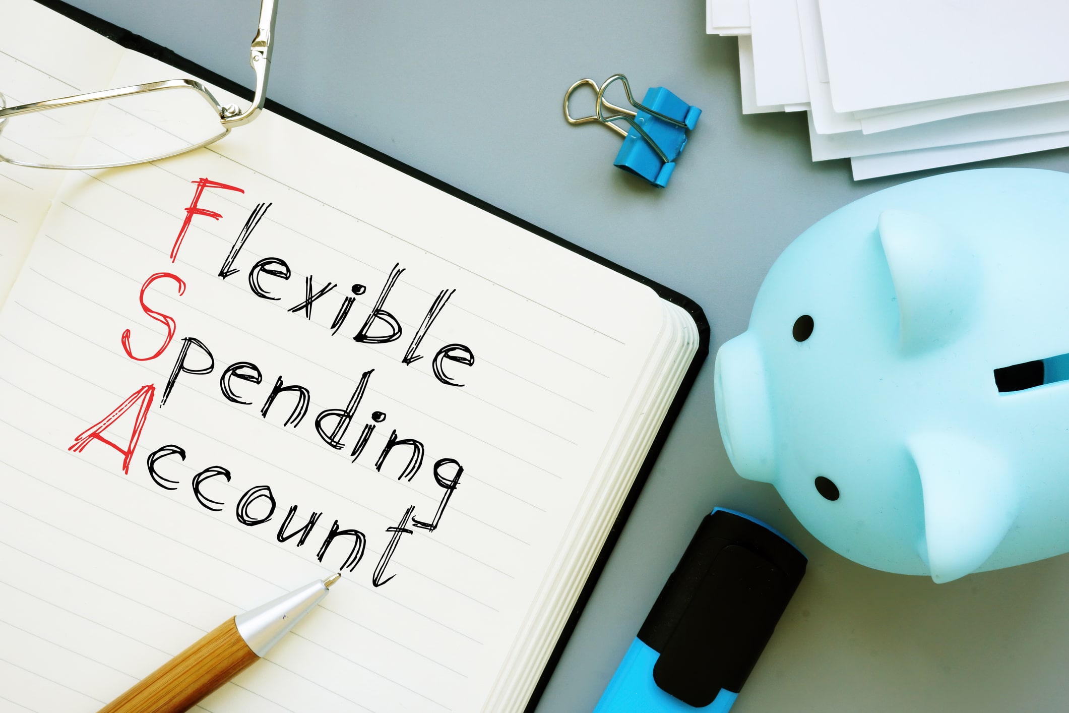 Flexible Spending Account FSA is shown on a conceptual business photo using the text