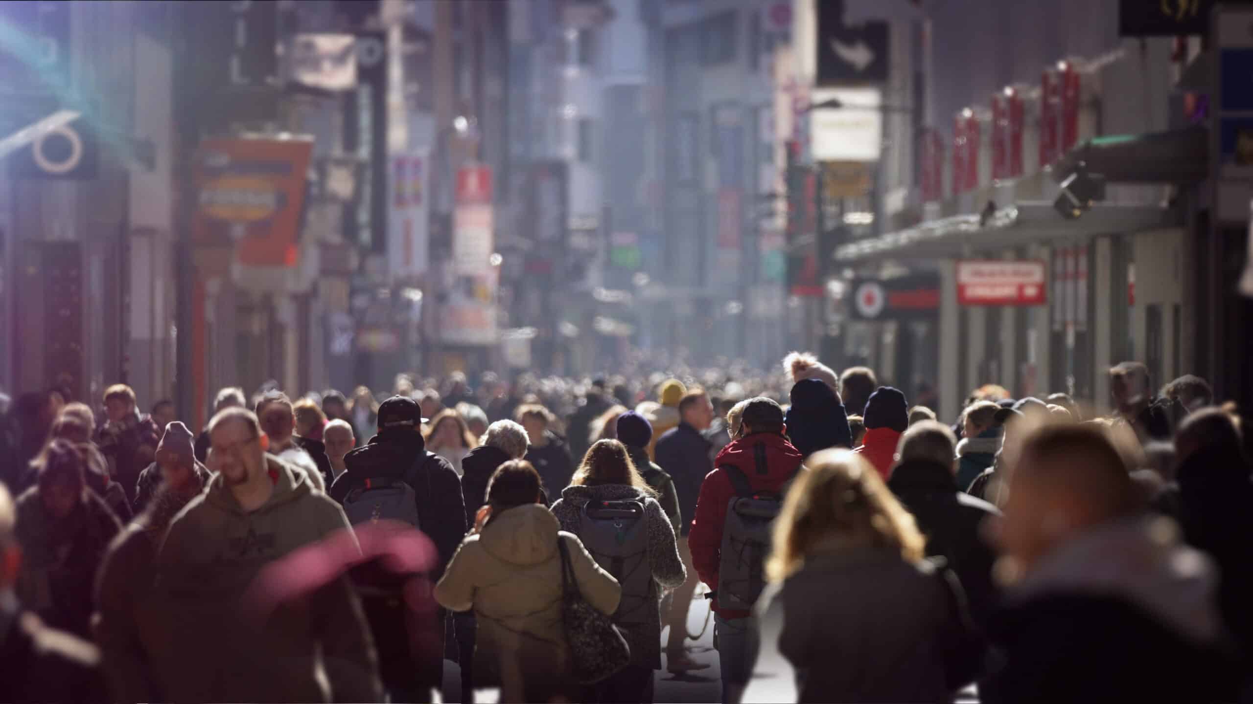 People walking down a crowded city street